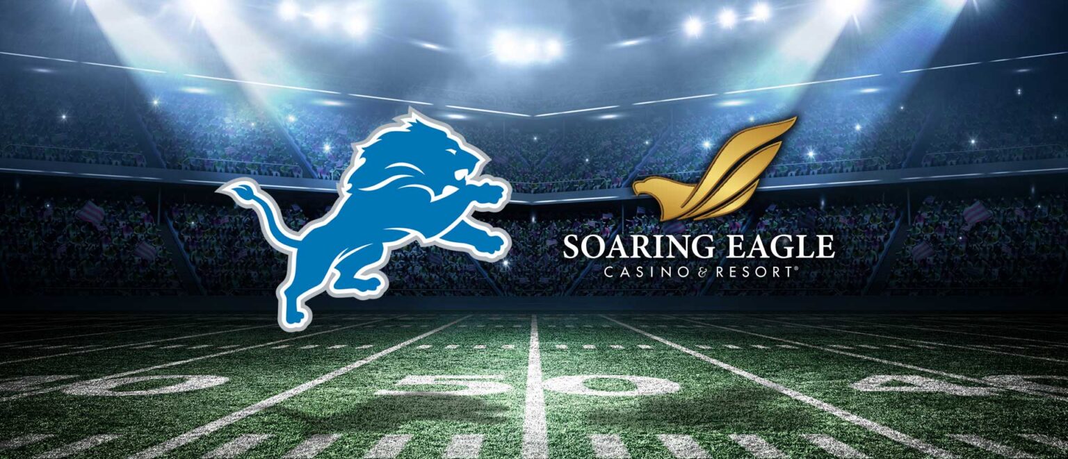 Detriot Lions and Soaring Eagle Logo in fromt of football field